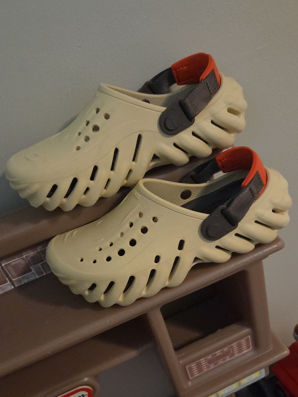 CROCS Kids Cream Slip-On Clog with Orange Heel Strap
